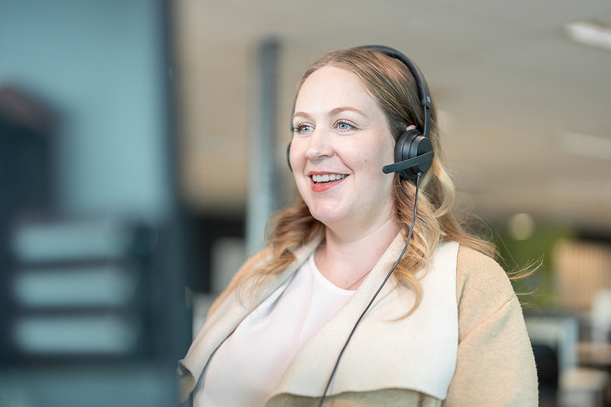 Lady with headset answering phone call